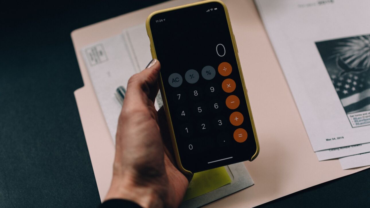 documents and a calculator on smartphone